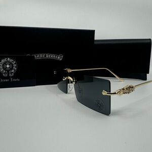 Chrome Hearts Sunglasses with Black Lenses and Gold Detailing